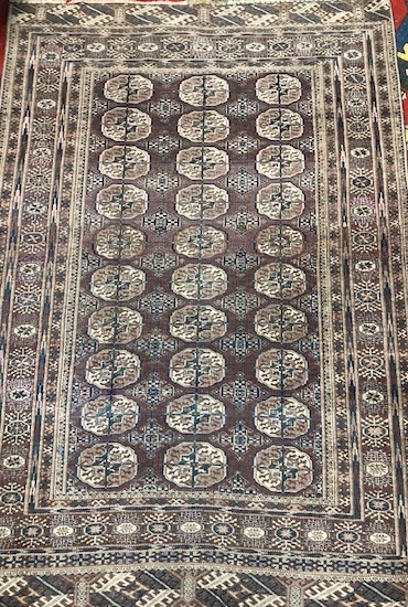 A Tekke Bokhara burgundy rug 184 x 124cm